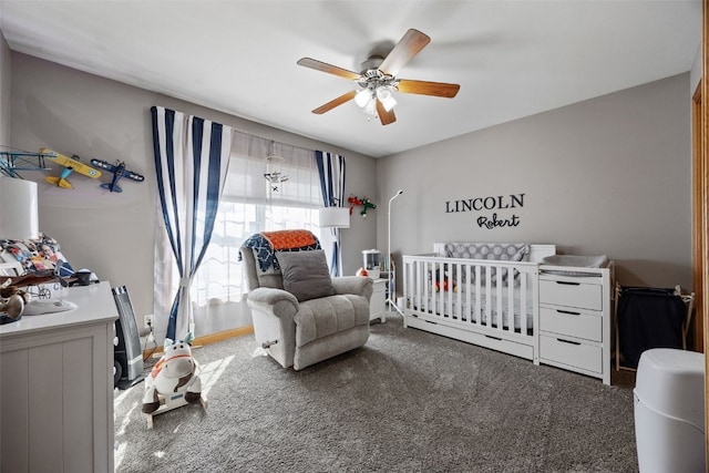 bedroom featuring baseboards, carpet floors, and a ceiling fan