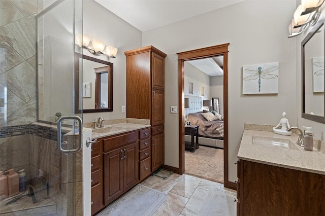 full bath with a sink, connected bathroom, two vanities, and a stall shower