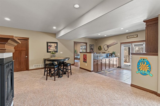 tiled dining space featuring recessed lighting, washer / dryer, visible vents, and carpet floors