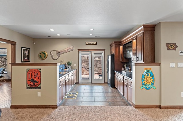 kitchen with baseboards, carpet flooring, recessed lighting, french doors, and freestanding refrigerator