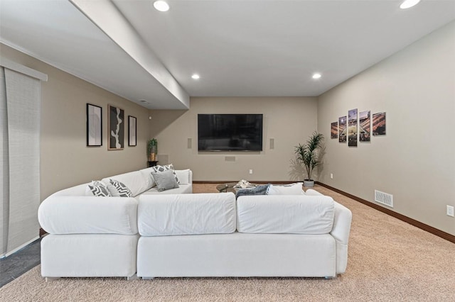 carpeted living room with recessed lighting, visible vents, and baseboards