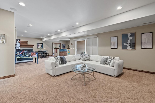 living area with visible vents, baseboards, carpet flooring, recessed lighting, and a fireplace