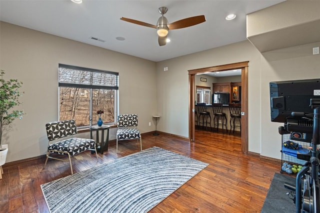 sitting room with a ceiling fan, baseboards, visible vents, recessed lighting, and hardwood / wood-style flooring