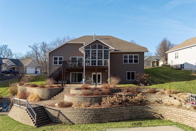 back of house featuring a yard, stairs, and a deck