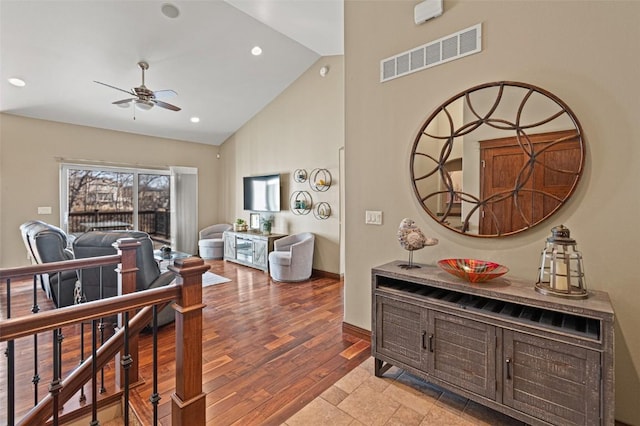 interior space with visible vents, high vaulted ceiling, wood finished floors, recessed lighting, and baseboards