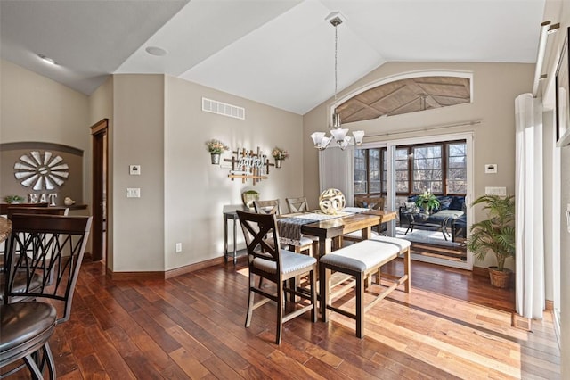 dining area featuring visible vents, dark wood finished floors, baseboards, a chandelier, and vaulted ceiling