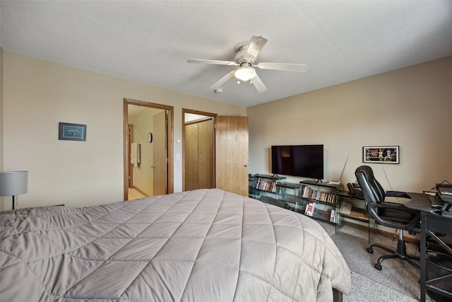 bedroom featuring a textured ceiling, ceiling fan, and carpet floors