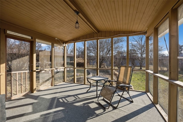 unfurnished sunroom with wooden ceiling and vaulted ceiling