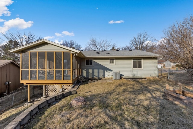 back of house featuring cooling unit, fence, and a sunroom