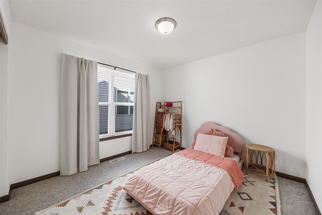 bedroom featuring visible vents, baseboards, and carpet floors