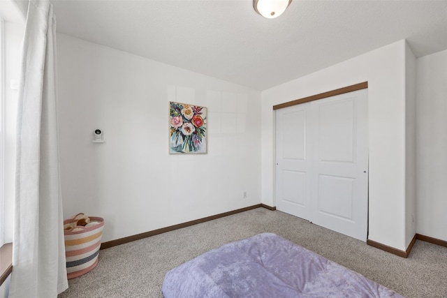 bedroom with baseboards, carpet, and vaulted ceiling