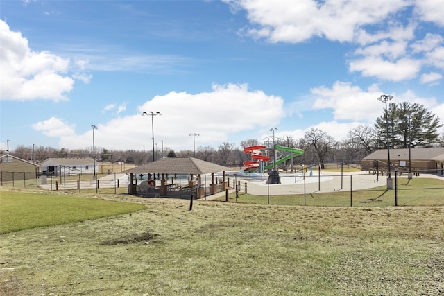 view of home's community featuring a gazebo, a yard, and fence