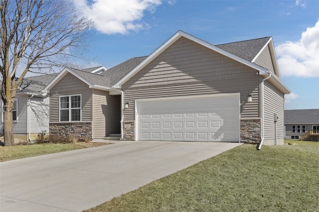 craftsman-style house with a front lawn, concrete driveway, roof with shingles, stone siding, and an attached garage