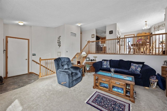 living room with carpet floors and a textured ceiling