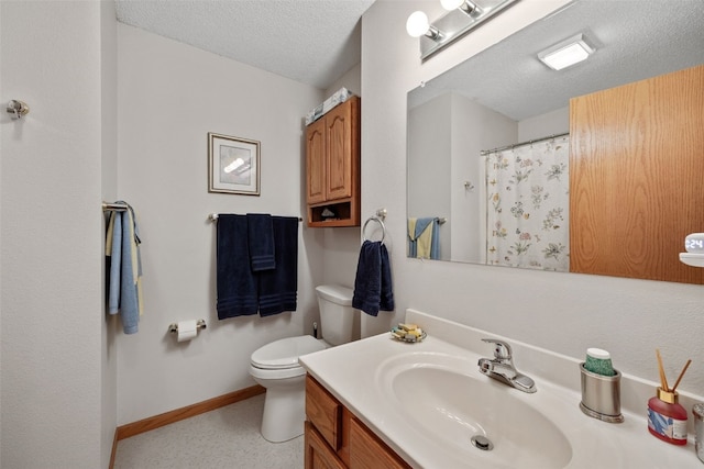 bathroom featuring toilet, curtained shower, a textured ceiling, baseboards, and vanity