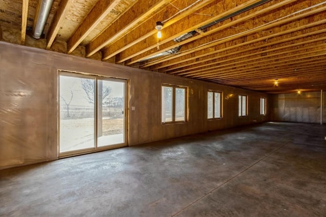 miscellaneous room featuring unfinished concrete flooring