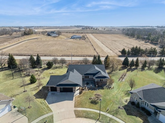 birds eye view of property with a rural view