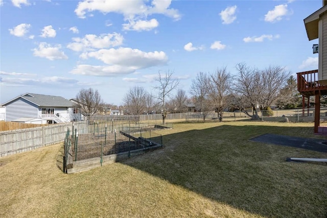 view of yard featuring a garden and fence