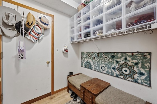 interior space with baseboards and light wood-style floors