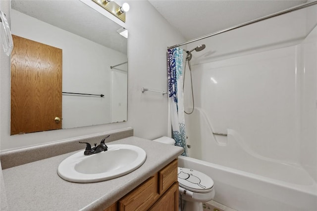 bathroom featuring vanity, shower / tub combo, and toilet