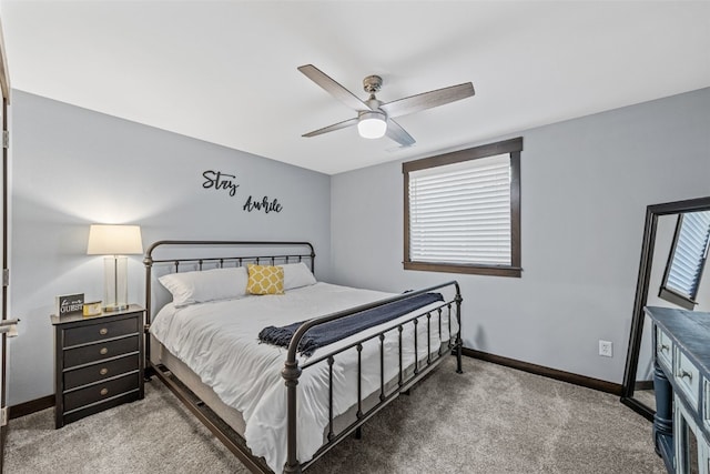 carpeted bedroom featuring a ceiling fan and baseboards