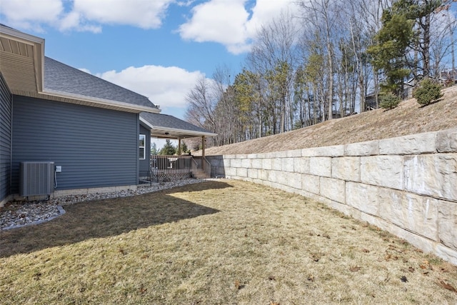 view of yard featuring central air condition unit