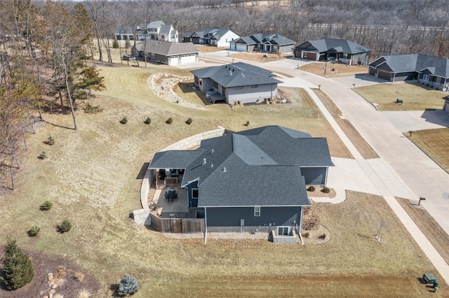 birds eye view of property with a residential view