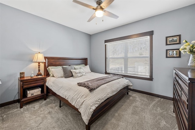 bedroom featuring baseboards, light carpet, and ceiling fan