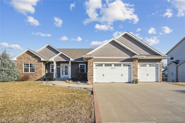 craftsman inspired home with a front lawn, an attached garage, stone siding, and driveway