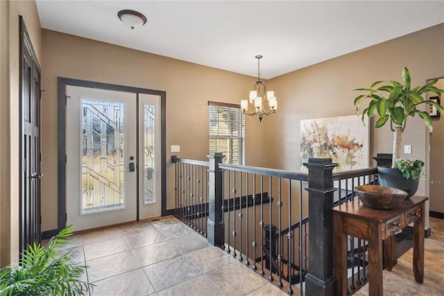 foyer entrance featuring an inviting chandelier