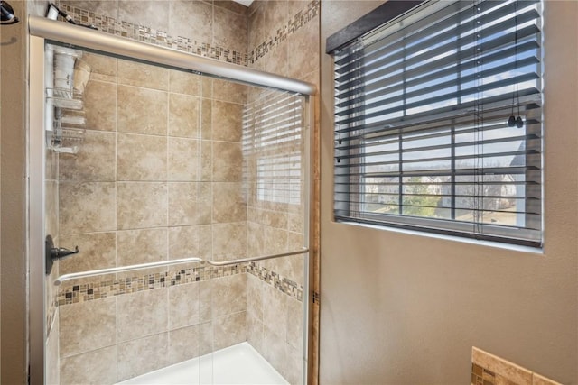 bathroom with a stall shower