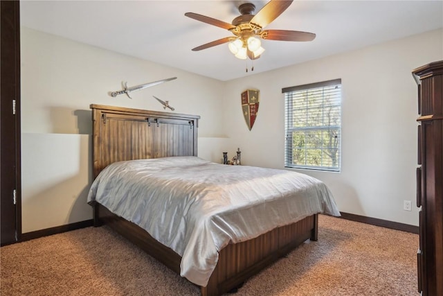 carpeted bedroom with baseboards and ceiling fan