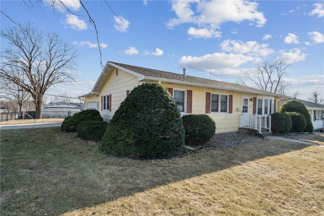 view of side of property featuring a yard