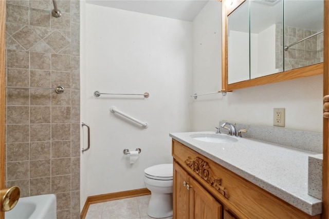 bathroom featuring tile patterned flooring, toilet, vanity, and baseboards