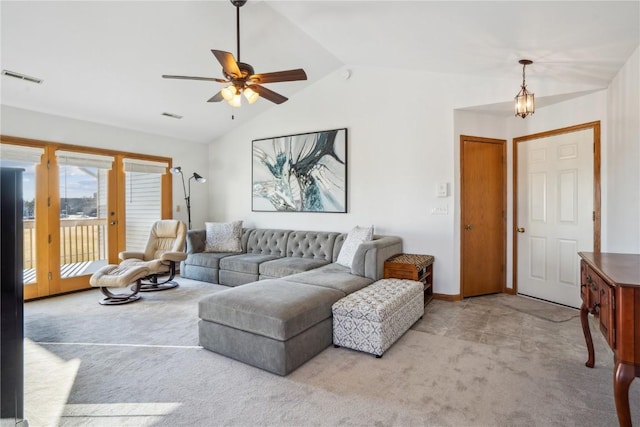 living area with a ceiling fan, lofted ceiling, carpet, and visible vents