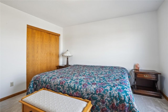 carpeted bedroom featuring baseboards