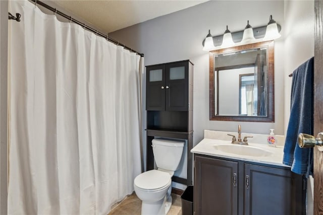 bathroom with toilet and vanity