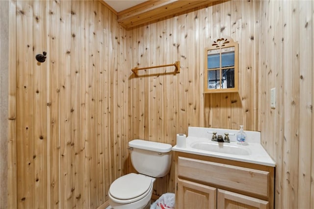 half bath featuring toilet and vanity