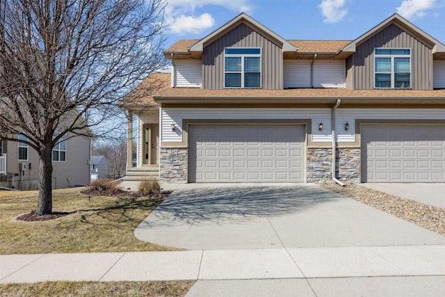 view of front of house featuring board and batten siding, concrete driveway, and an attached garage