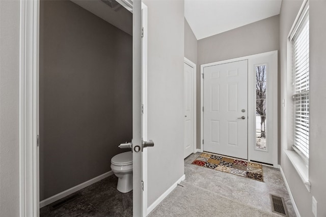 entryway with baseboards and visible vents