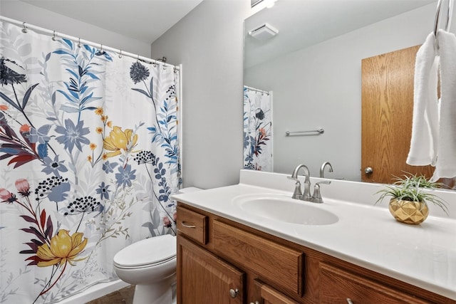 bathroom featuring vanity, toilet, and a shower with curtain