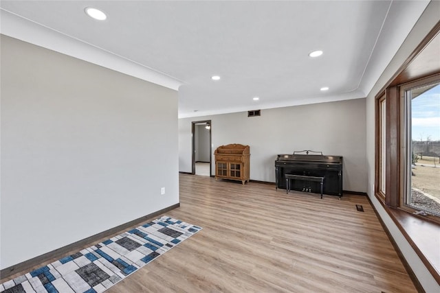 interior space with recessed lighting, visible vents, baseboards, and light wood-style flooring