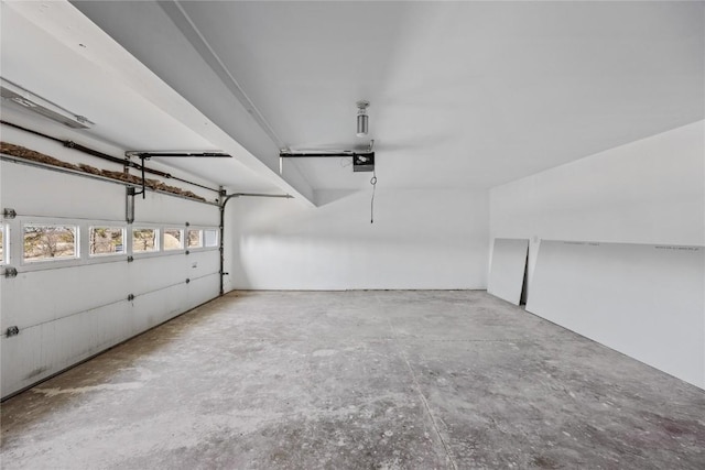 2261 Creekside Rd, Springville, IA 52336 - garage featuring a garage door opener
