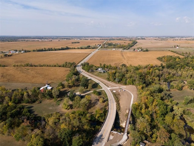 birds eye view of property with a rural view