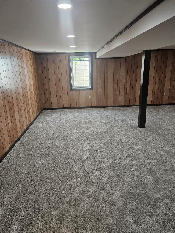 2261 Creekside Rd, Springville, IA 52336 - basement with carpet and wooden walls