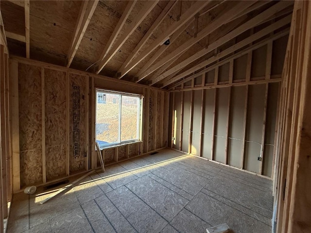 miscellaneous room with lofted ceiling