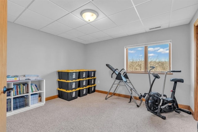 workout area with a drop ceiling, baseboards, carpet, and visible vents