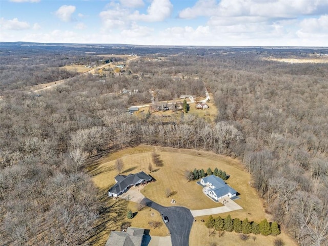 aerial view featuring a wooded view