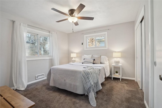 carpeted bedroom featuring a ceiling fan, baseboards, and a closet