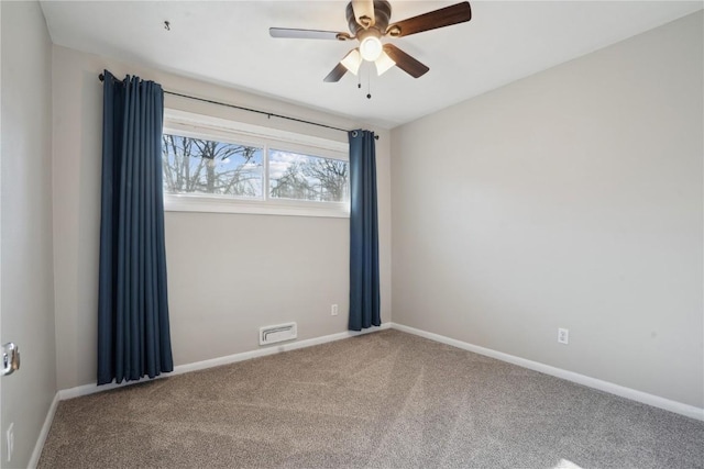 spare room featuring visible vents, ceiling fan, baseboards, and carpet floors